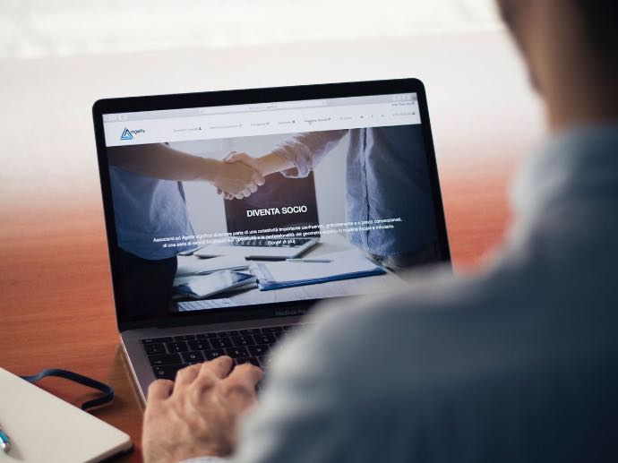 man operating the MacBook Pro